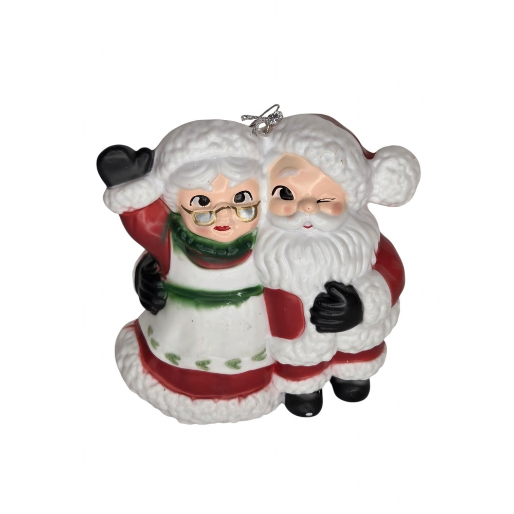 Vintage Style Santa and Mrs Claus Christmas Ornament Winking Hugging Holiday